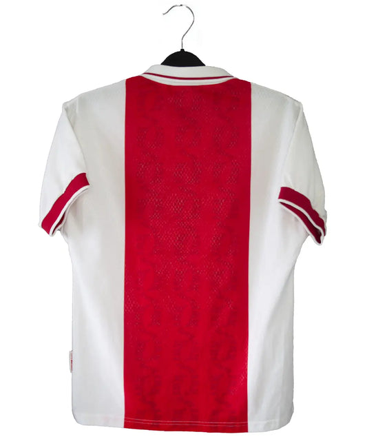 Maillot domicile de l'ajax de la saison 1998-1999 de couleur rouge et blanc. On peut voir l'équipementier umbro et le sponsor ABN AMRO