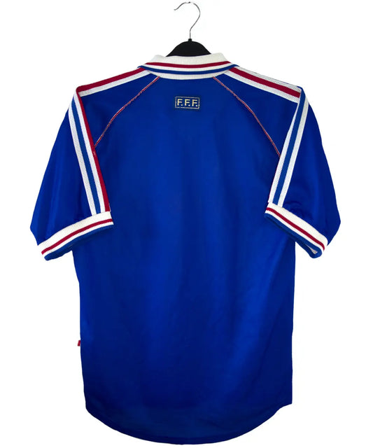 Maillot de foot vintage bleu blanc et rouge de l'équipe de france 1998. On peut retrouver l'équipementier adidas