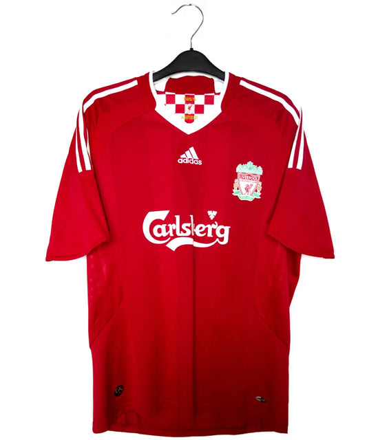 Maillot domicile de liverpool de la saison 2008 jusqu'à 2010. Le maillot est de couleur rouge et blanc. On peut retrouver l'équipementier adidas et le sponsor carlsberg. Le maillot est floqué du numéro 9 torres