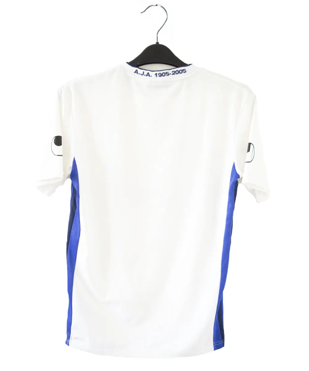 Maillot domicile de l'AJ Auxerre de couleur blanc et bleu. On peut retrouver l'équipementier uhlsport et les sponsors PSP et Playstation