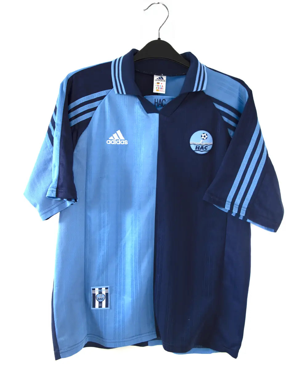 Maillot domicile du havre de la saison 1998-1999 de couleur bleu clair et bleu foncé. On peut voir l'équipementier adidas.