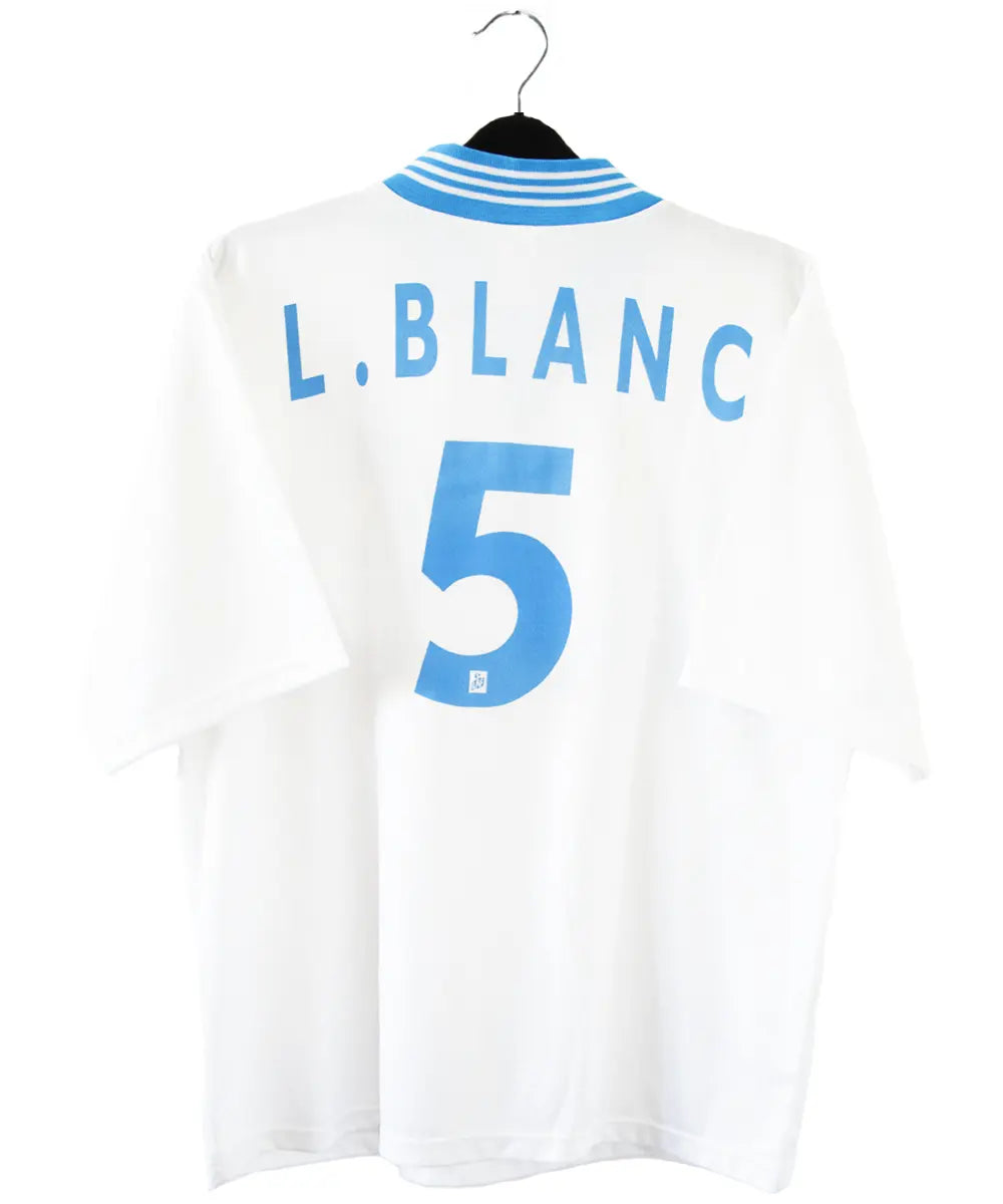 Maillot domicile blanc et bleu de l'olympique de marseille de la saison 1997-1998. Le maillot est floqué du numéro 5 Laurent Blanc
