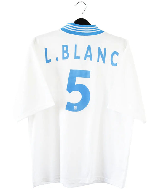 Maillot domicile blanc et bleu de l'olympique de marseille de la saison 1997-1998. Le maillot est floqué du numéro 5 Laurent Blanc