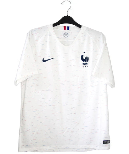 Maillot vintage extérieur de l'équipe de france 2018 de couleur blanc. On peut retrouver l'équipementier nike