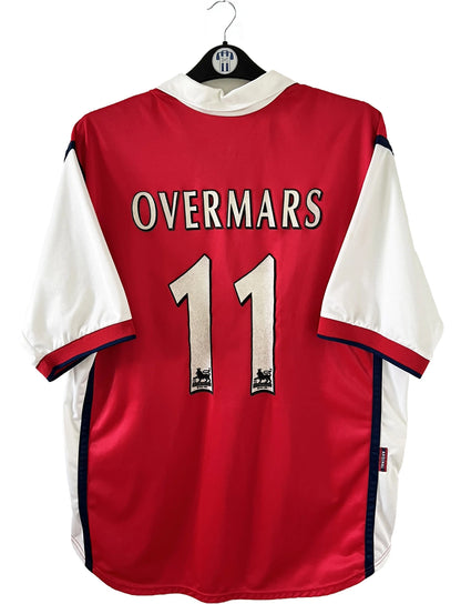 Maillot de foot vintage domicile rouge d'arsenal de la saison 1999/2000. On peut retrouver l'équipementier Nike et le sponsor Dreamcast. Le maillot est floqué du numéro 11 Marc Overmars. Il s'agit d'un maillot authentique d'époque.