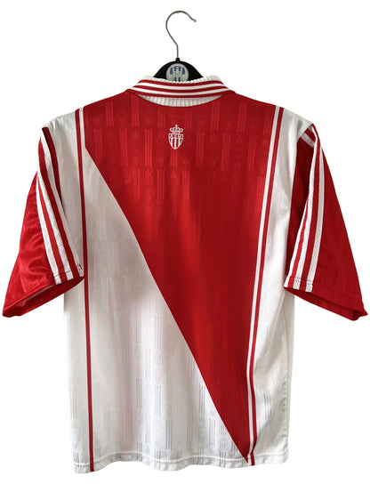 Maillot de foot vintage domicile rouge et blanc de l'AS Monaco 1997/1998. n peut retrouver l'équipementier Adidas et le sponsor Continental Edison. Il s'agit d'un maillot authentique d'époque.