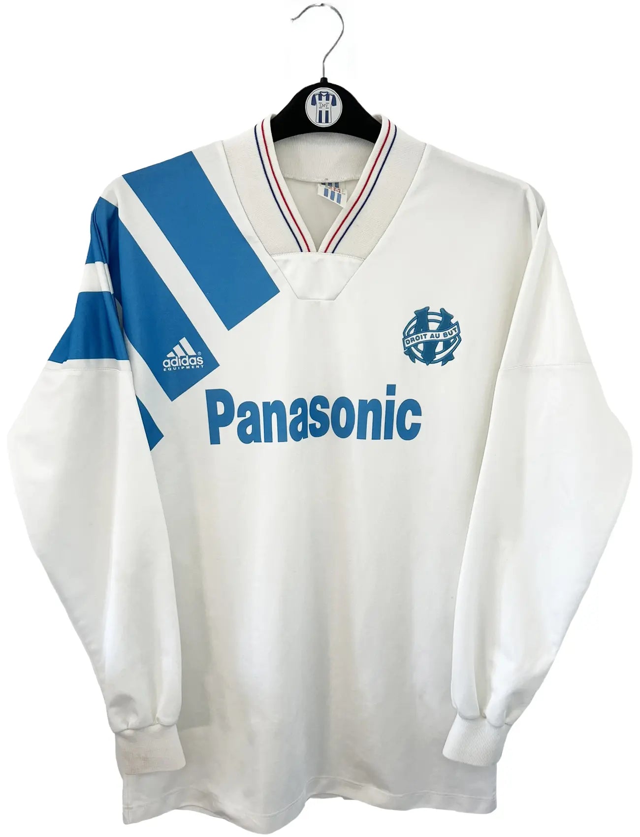 Maillot foot vintage domicile blanc et bleu de l'om de la saison 1991-1992. On peut retrouver l'équipementier adidas et le sponsor Panasonic. Il s'agit d'un maillot authentique d'époque.