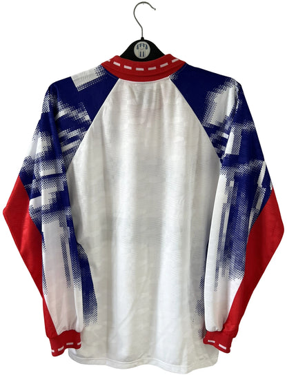 Maillot de foot vintage domicile blanc du PSG de la saison 1992/1993. On peut retrouver l'équipementier Nike et les sponsors Commoore et Tourtel. Il s'agit d'un maillot authentique d'époque.