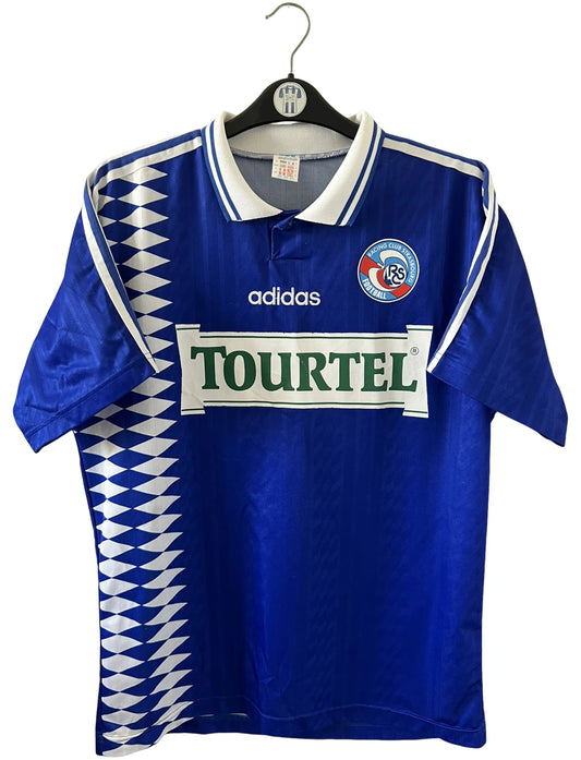 Maillot de foot vintage domicile bleu du RC Strasbourg de la saison 1994/1995. On peut retrouver l'équipementier Adidas et le sponsor Tourtel. Il s'agit d'un maillot authentique d'époque.