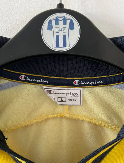 Maillot de foot vintage domicile jaune du FC Sochaux-Montbliard, de la saison 2002/2004. On peut retrouver l'équipementier Champion et le sponsor Esso. Il s'agit d'un maillot authentique d'époque.