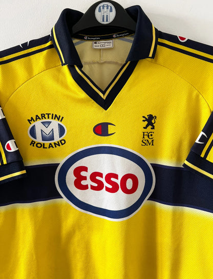 Maillot de foot vintage domicile jaune du FC Sochaux Montbéliard. On peut retrouver l'équipementier Champion et le sponsor Esso. Il s'agit d'un maillot authentique d'époque.