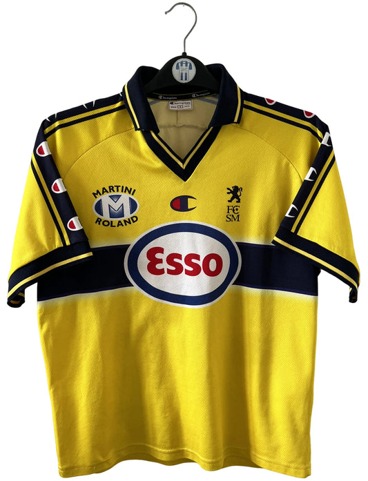 Maillot de foot vintage domicile jaune du FC Sochaux Montbéliard. On peut retrouver l'équipementier Champion et le sponsor Esso. Il s'agit d'un maillot authentique d'époque.
