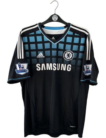 Maillot de foot vintage extérieur chelsea 2011/2012. On peut retrouver l'équipementier Adidas et le sponsor Samsung. Le maillot est floqué du numéro 9 Fernando Torres. Il s'agit d'un maillot authentique d'époque