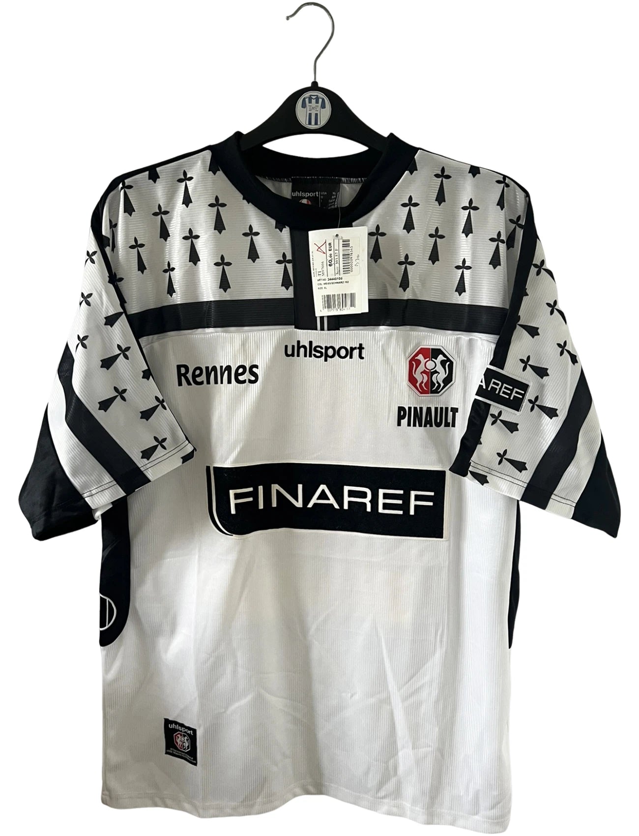 Maillot de foot vintage extérieur blanc et noir du Stade Rennais saison 2002/2003. On peut retrouver l'équimentier Uhlsport et le sponsor Finaref. Il s'agit d'un maillot authentique d'époque.