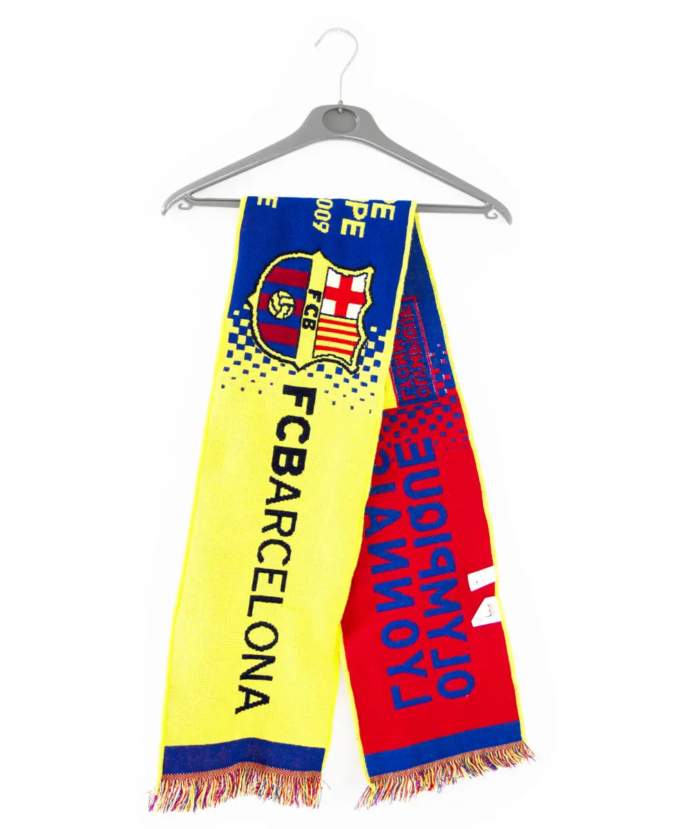 Echarpe éditée lors du huitième de finale de ligue des champions entre lyon et le fc barcelone. L'écharpe est de couleur jaune, bleu et rouge