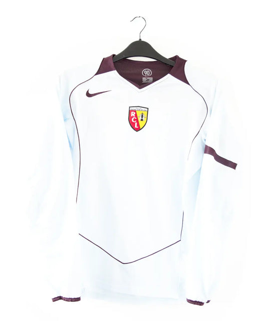 Maillot extérieur de lens 2004-2005 de couleur bleu et rouge. On retrouve l'équipementier nike